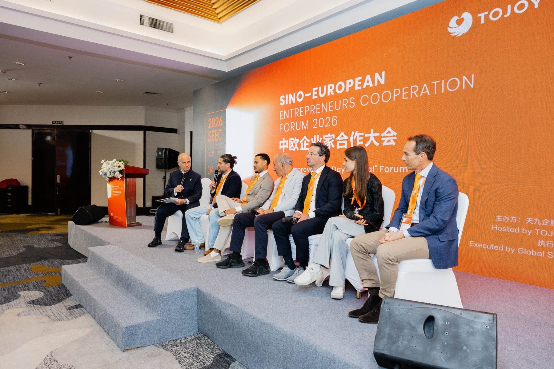 Panel conversation on stage at a Big Improvement Day forum.